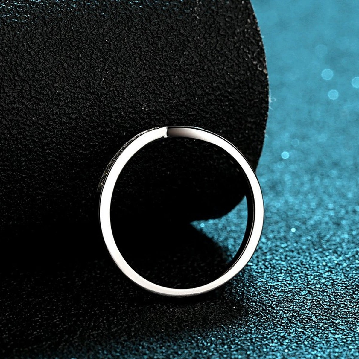 Slim Moissanite Band Ring in Rhodium-Plated S925 Sterling Silver blue display product photo showing the moissanite setting and band profile