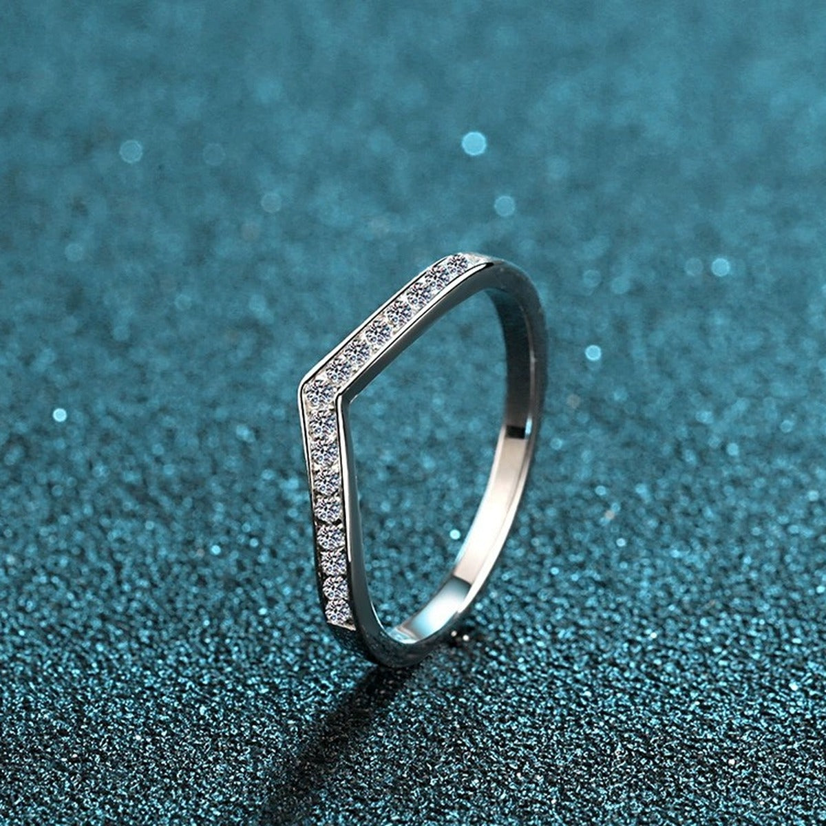 Slim Moissanite Band Ring in Rhodium-Plated S925 Sterling Silver blue display product photo showing the moissanite setting and band profile