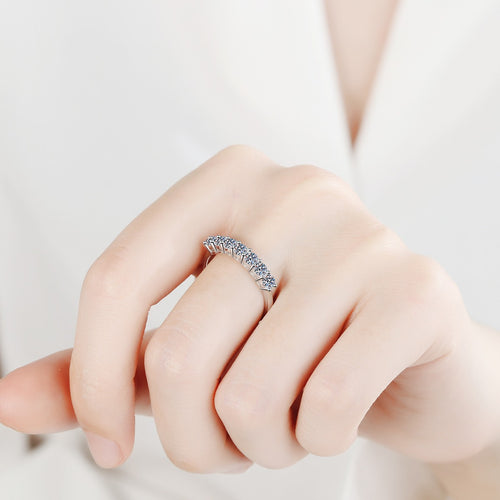 Curved Pave Moissanite Band Ring in Rhodium-Plated S925 Sterling Silver worn on hand, showing scale, finger coverage, and rhodium-plated finish