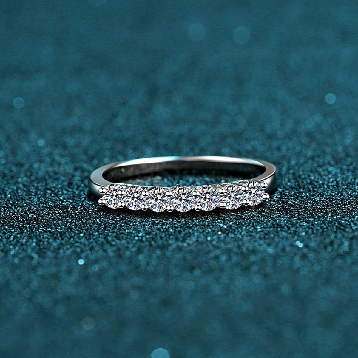 Curved Pave Moissanite Band Ring in Rhodium-Plated S925 Sterling Silver blue display product photo showing the moissanite setting and band profile