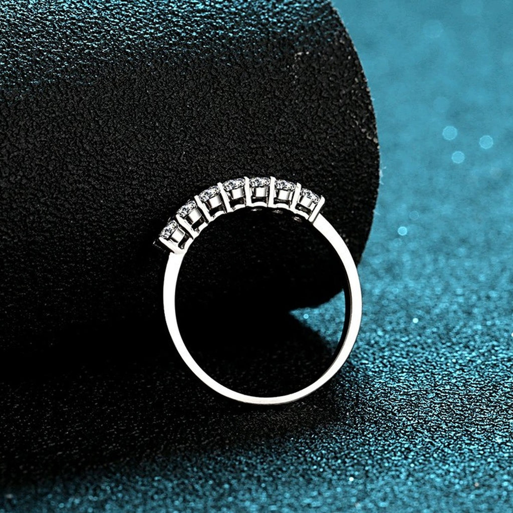 Curved Pave Moissanite Band Ring in Rhodium-Plated S925 Sterling Silver blue display product photo showing the moissanite setting and band profile