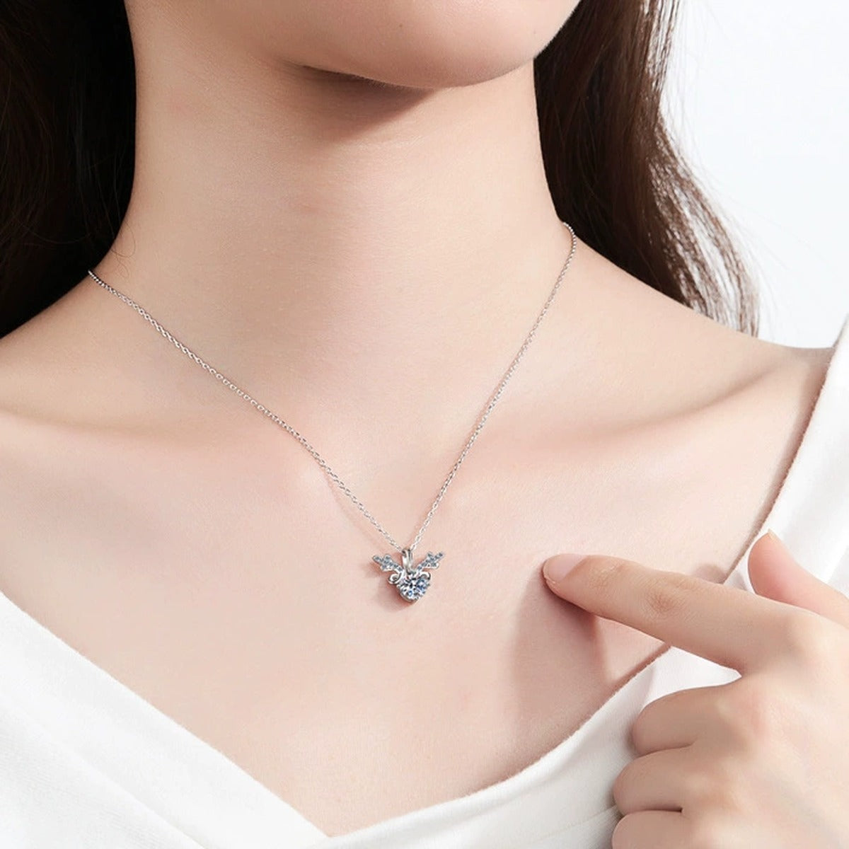Deer Antler Moissanite Pendant Necklace with CZ in Rhodium-Plated S925 sterling silver worn on neckline by model showing scale and adjustable chain styling