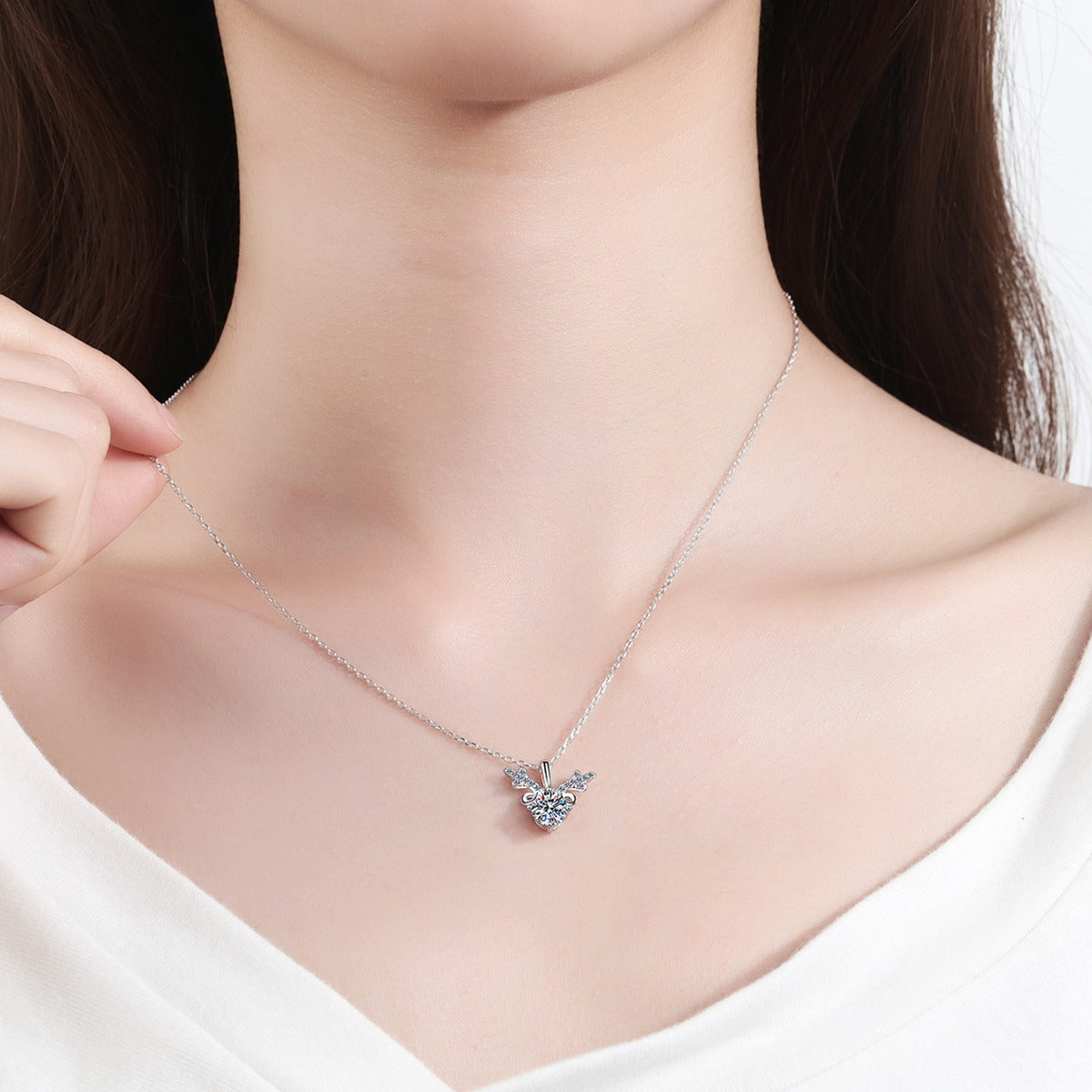 Deer Antler Moissanite Pendant Necklace with CZ in Rhodium-Plated S925 sterling silver worn on neckline by model showing scale and adjustable chain styling