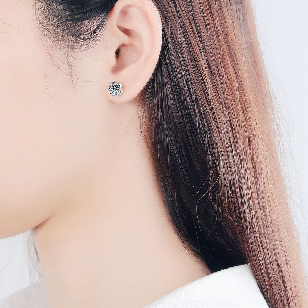 Round Moissanite Stud Earrings in Rhodium-Plated S925 Sterling Silver worn on ear by model to show scale, drop length, and everyday styling