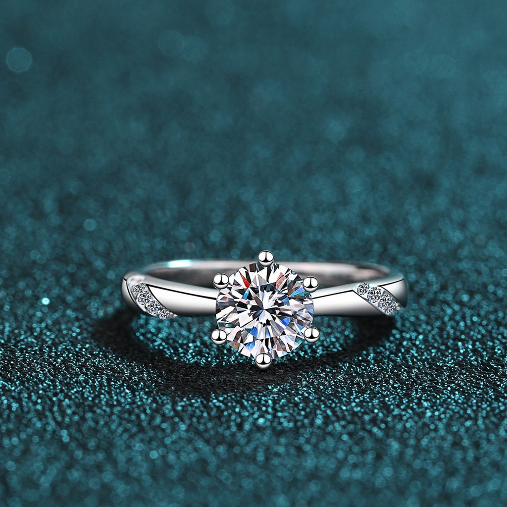Round Moissanite Solitaire Ring in Rhodium-Plated S925 Sterling Silver blue display product photo showing the moissanite setting and band profile