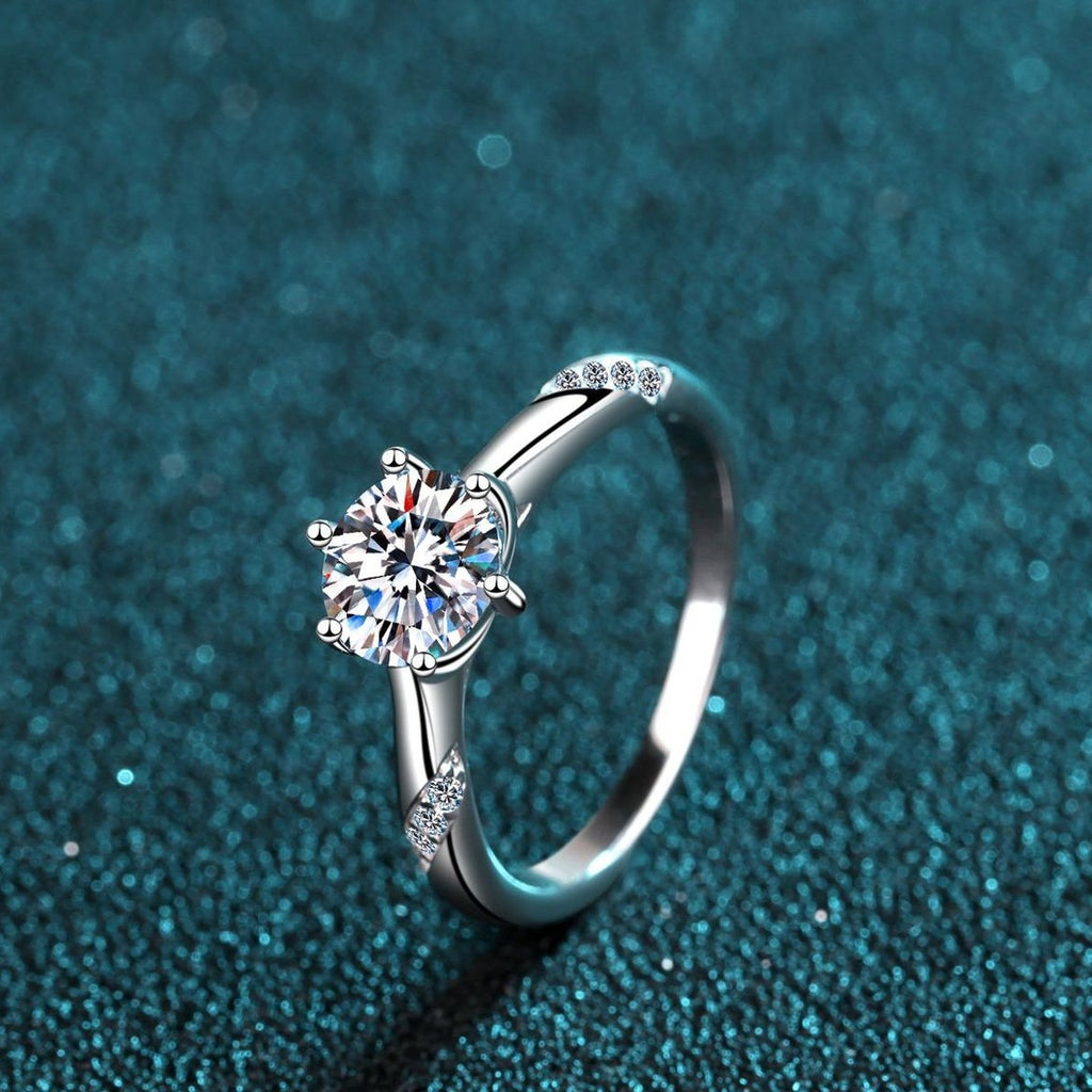 Round Moissanite Solitaire Ring in Rhodium-Plated S925 Sterling Silver blue display product photo showing the moissanite setting and band profile