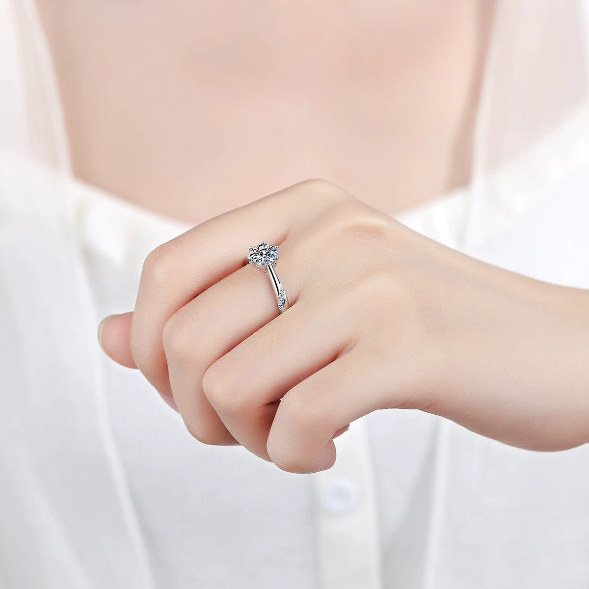 Round Moissanite Solitaire Ring in Rhodium-Plated S925 Sterling Silver studio product angle showing the ring setting, stone detail, and band design