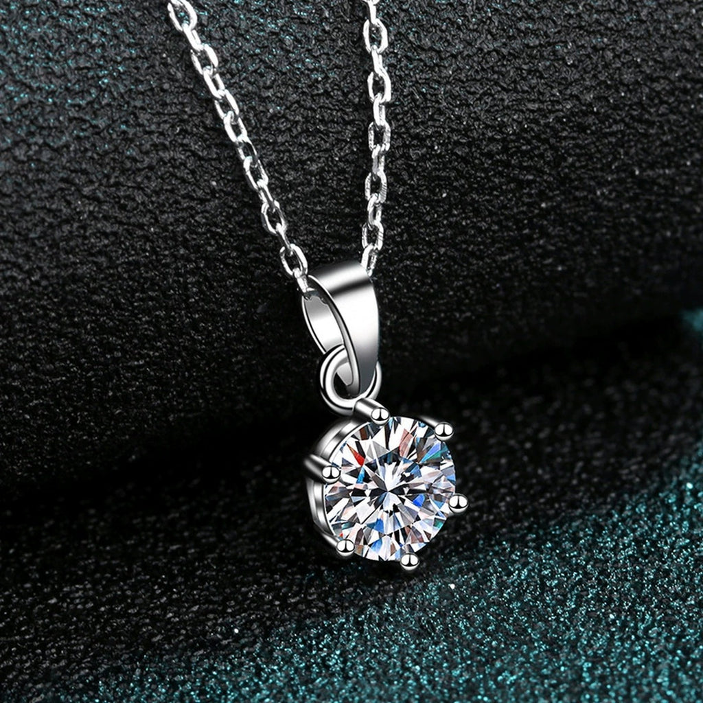 Solitaire Moissanite Pendant Necklace in Rhodium-Plated S925 sterling silver product scene view showing chain and setting detail