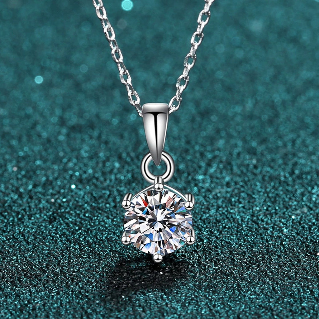 Solitaire Moissanite Pendant Necklace in Rhodium-Plated S925 sterling silver product scene view showing angled sparkle