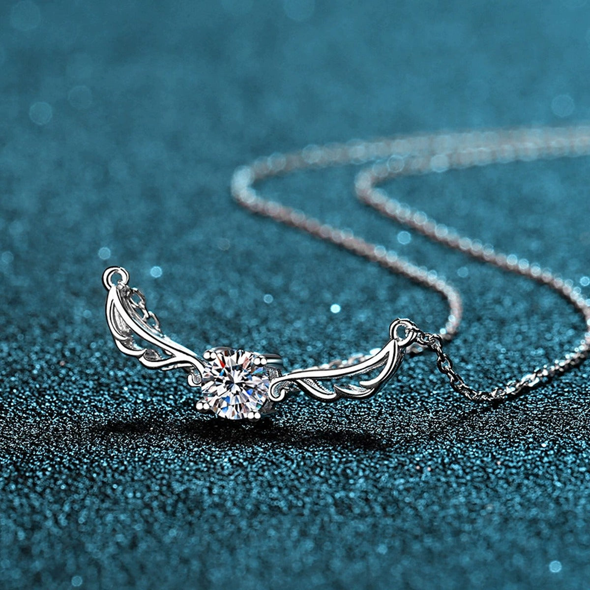 Angel Wing Moissanite Pendant Necklace in Rhodium-Plated S925 sterling silver product scene view showing chain and setting detail