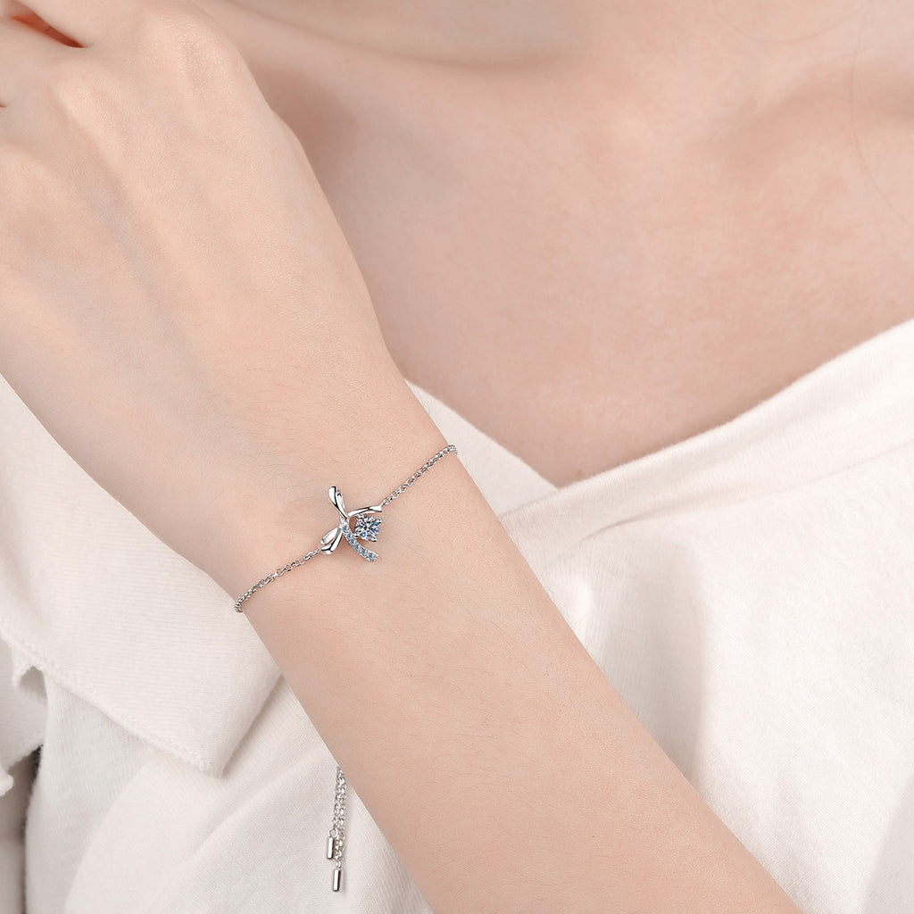 Bow Moissanite Adjustable Bracelet with CZ in Rhodium-Plated S925 sterling silver worn on wrist model view showing scale and adjustable fit