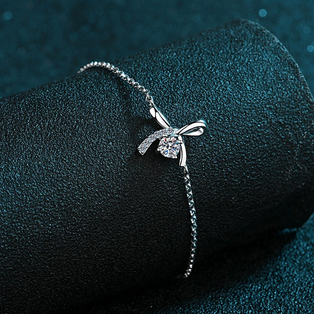 Bow Moissanite Adjustable Bracelet with CZ in Rhodium-Plated S925 sterling silver angled product display showing bracelet silhouette