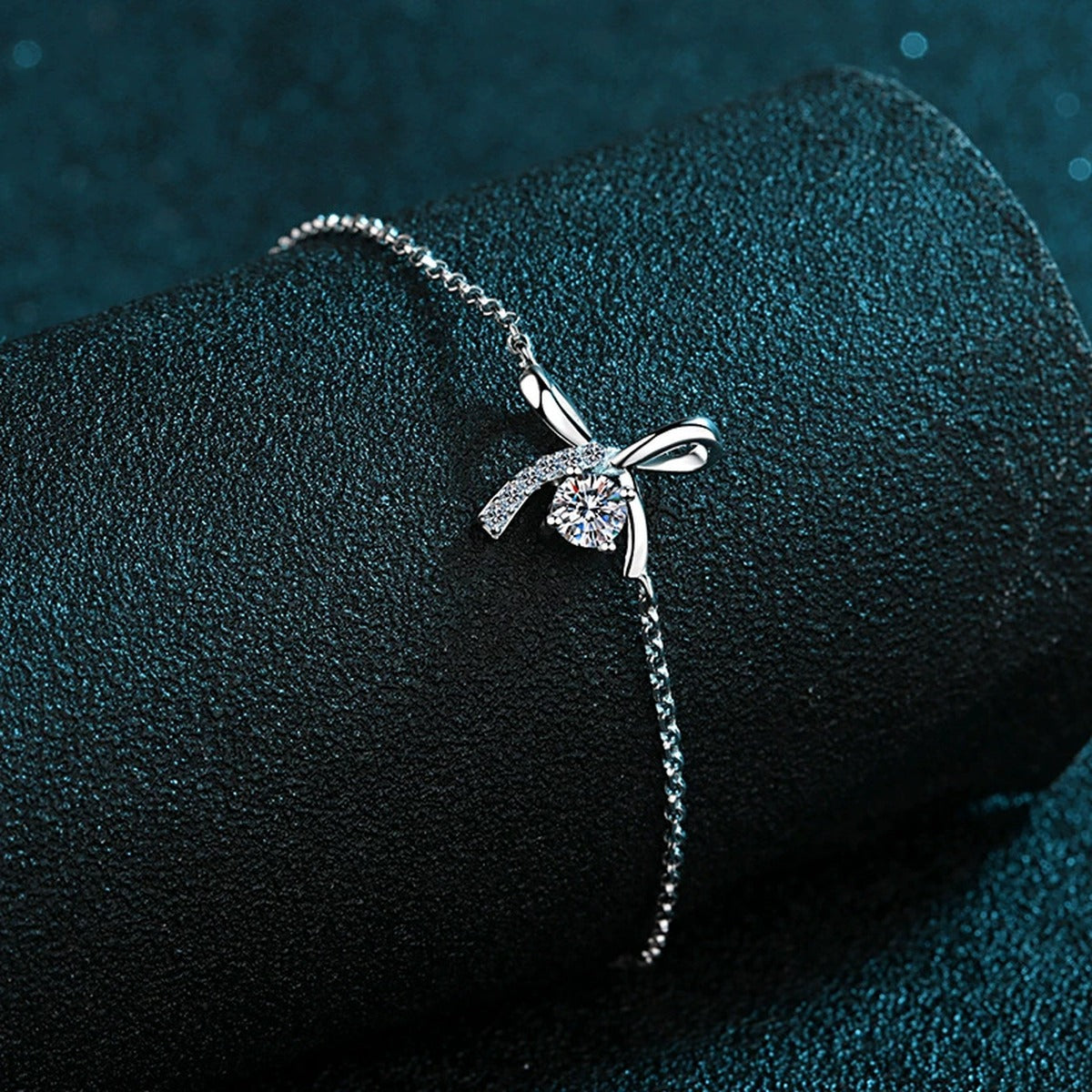 Bow Moissanite Adjustable Bracelet with CZ in Rhodium-Plated S925 sterling silver angled product display showing bracelet silhouette