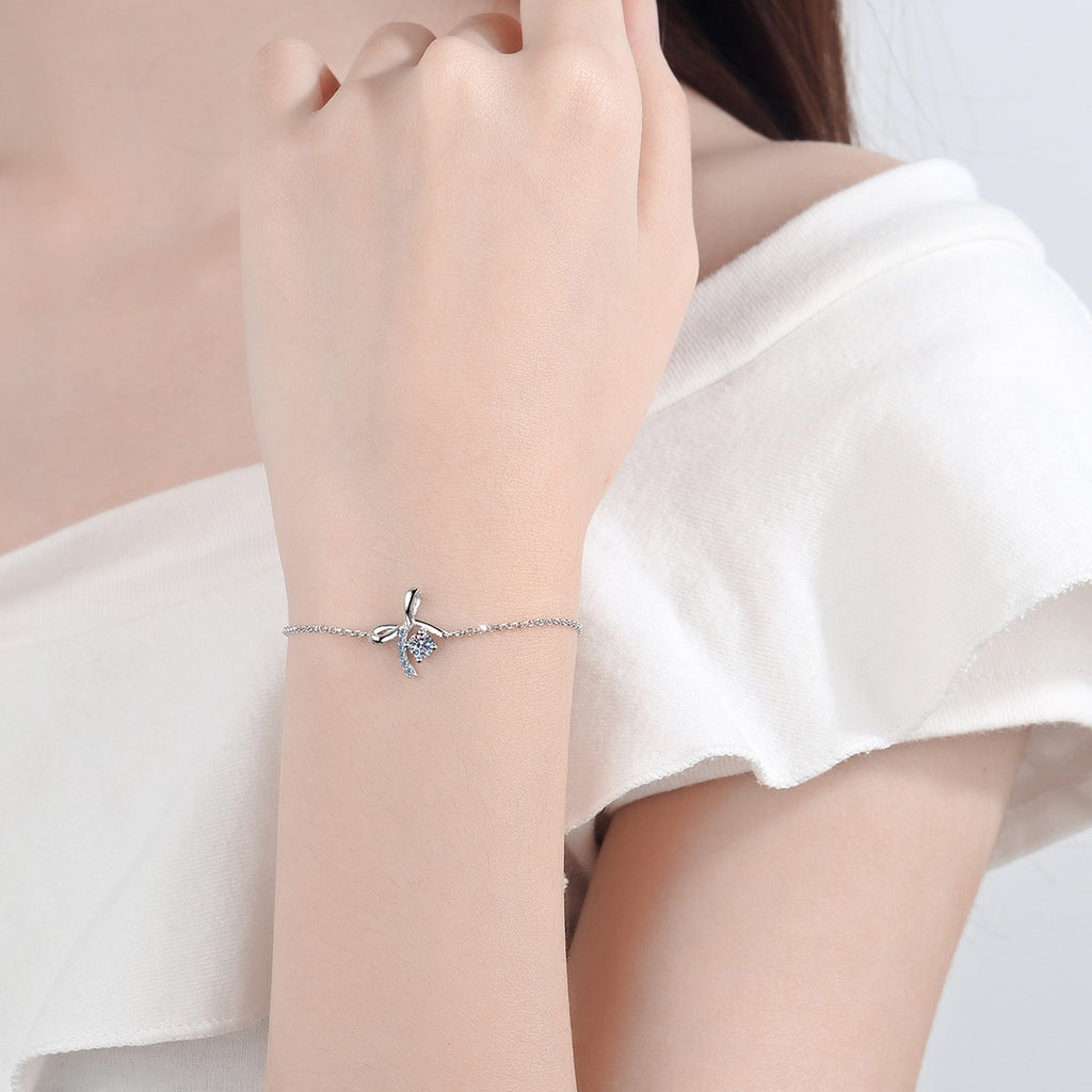Bow Moissanite Adjustable Bracelet with CZ in Rhodium-Plated S925 sterling silver worn on wrist model view showing scale and adjustable fit