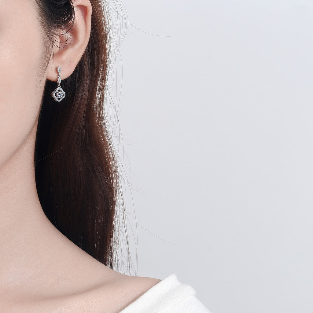 Clover Moissanite Stud Dangle Earrings with CZ in Rhodium-Plated S925 Sterling Silver worn on ear by model to show scale, drop length, and everyday styling