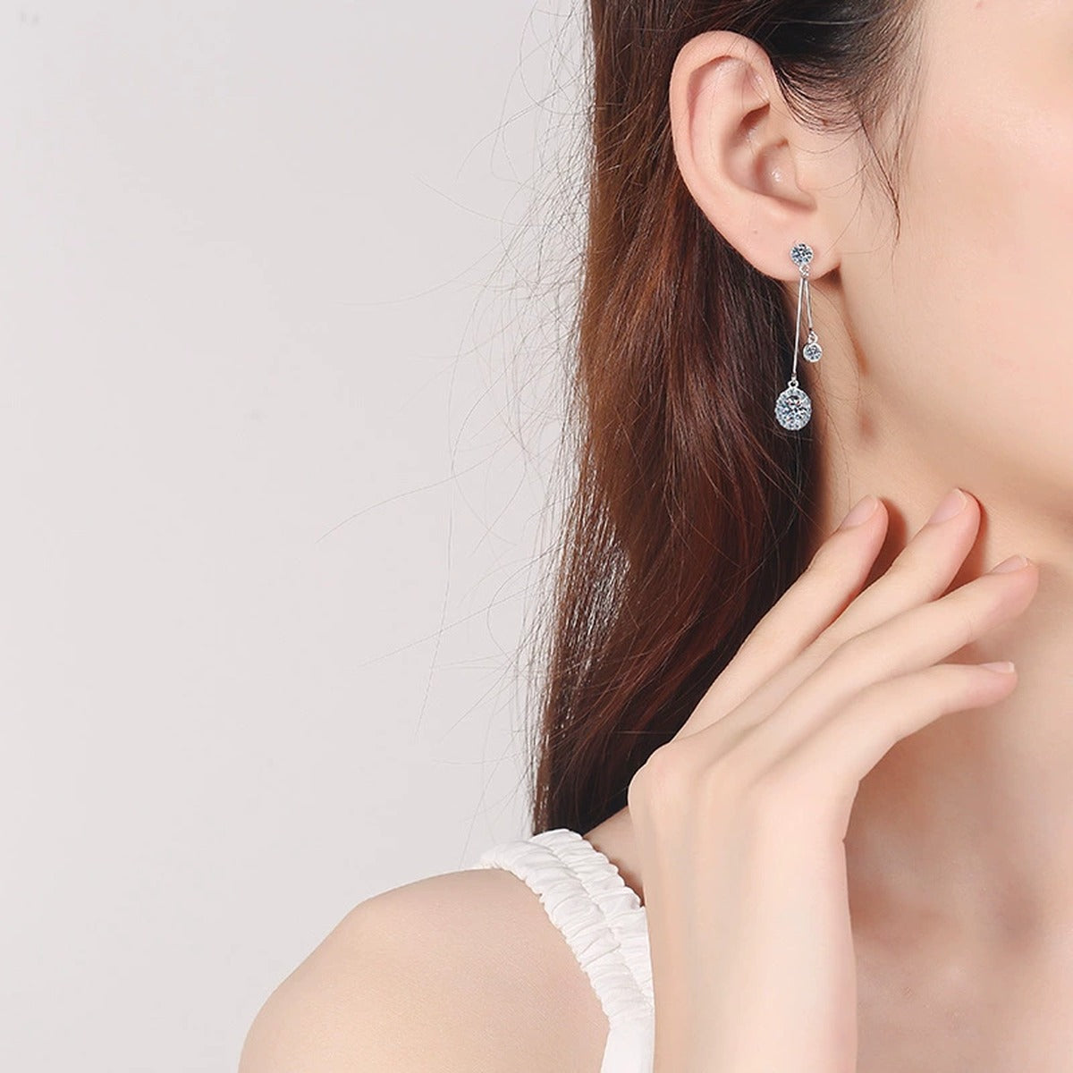 Linear Moissanite Stud Dangle Earrings with CZ in Rhodium-Plated S925 Sterling Silver worn on ear by model to show scale, drop length, and everyday styling