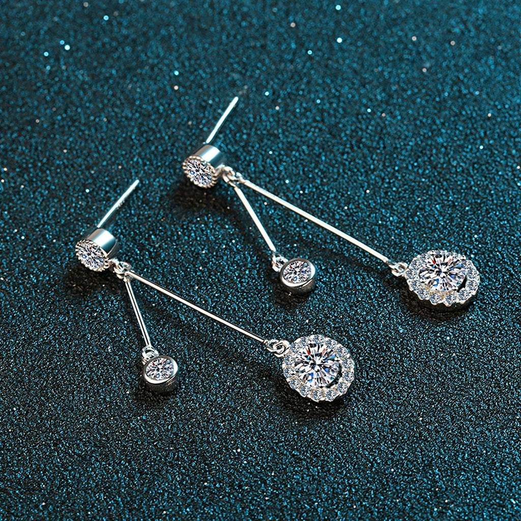 Linear Moissanite Stud Dangle Earrings with CZ in Rhodium-Plated S925 Sterling Silver on blue-green fabric showing angled setting view