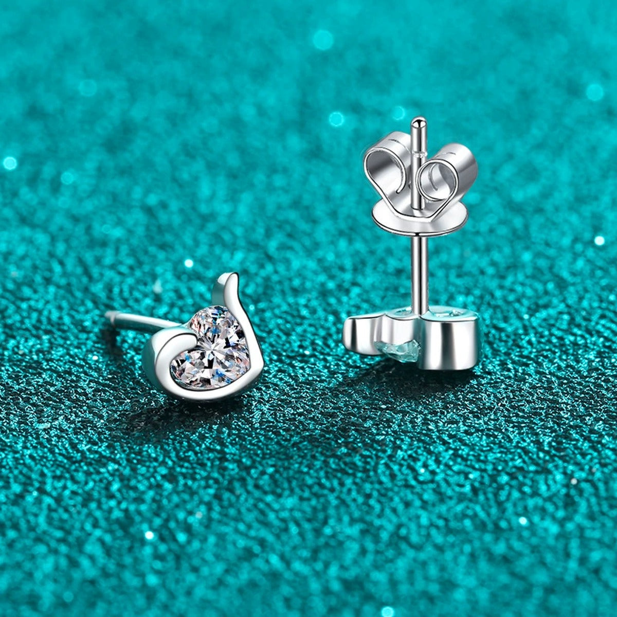 Heart Moissanite Stud Earrings in Rhodium-Plated S925 sterling silver product scene view showing angled setting detail
