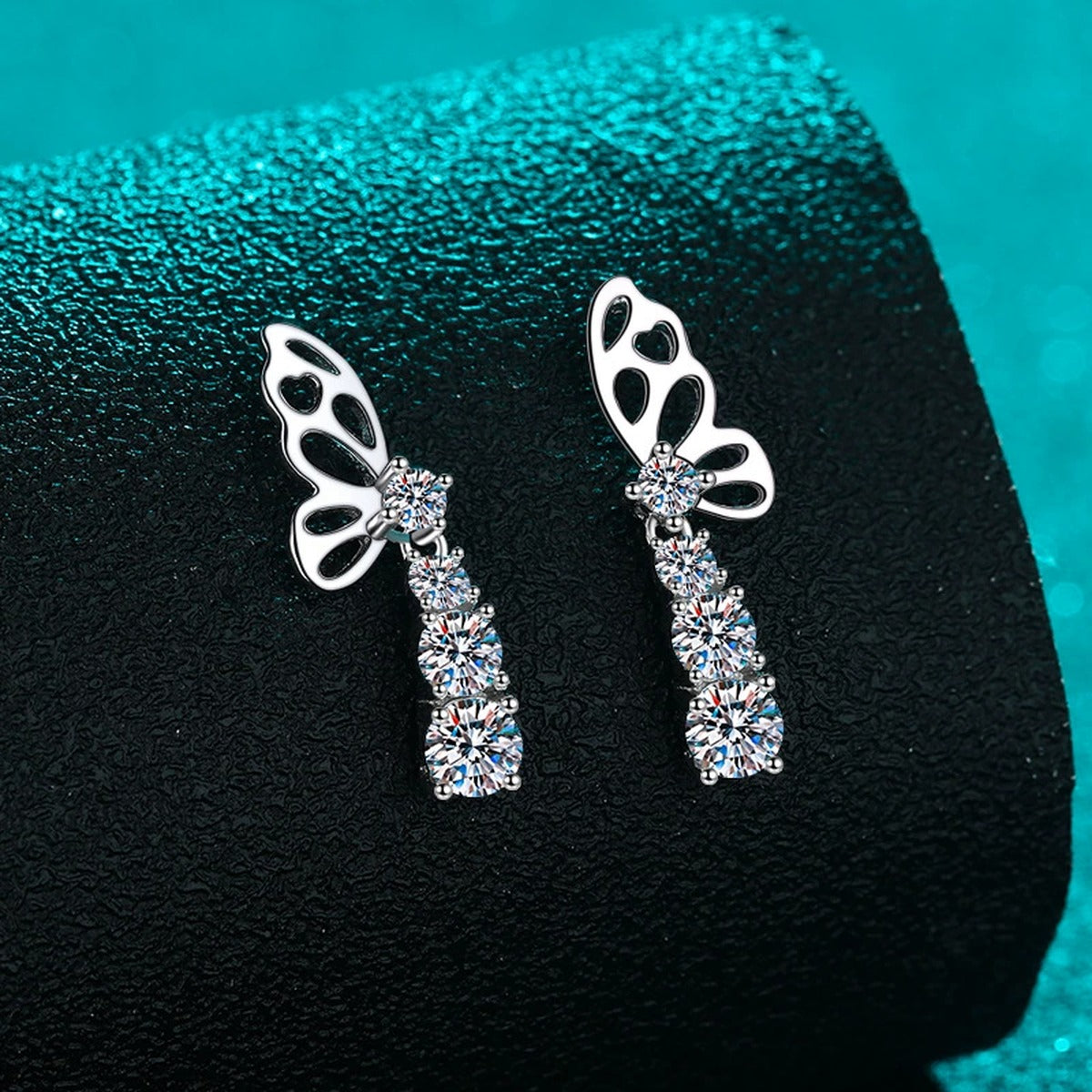 Butterfly Moissanite Stud Drop Earrings in Rhodium-Plated S925 sterling silver product scene view showing angled setting detail