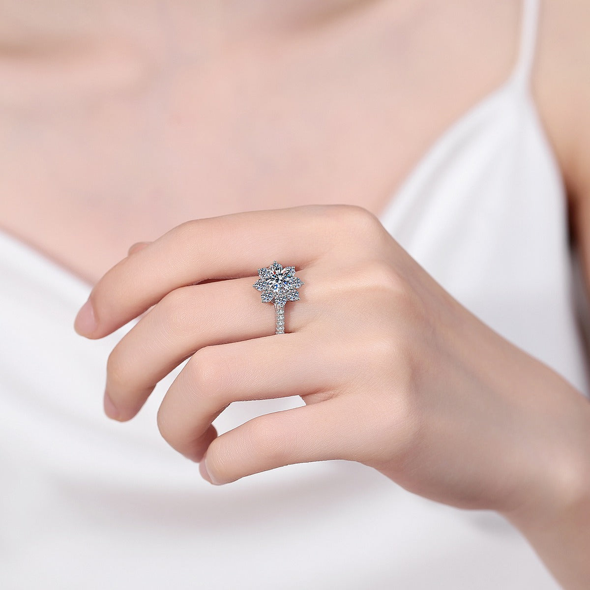 Round Moissanite Side Stone Engagement Ring with CZ in Rhodium-Plated S925 Sterling Silver worn on hand, showing scale, finger coverage, and rhodium-plated finish