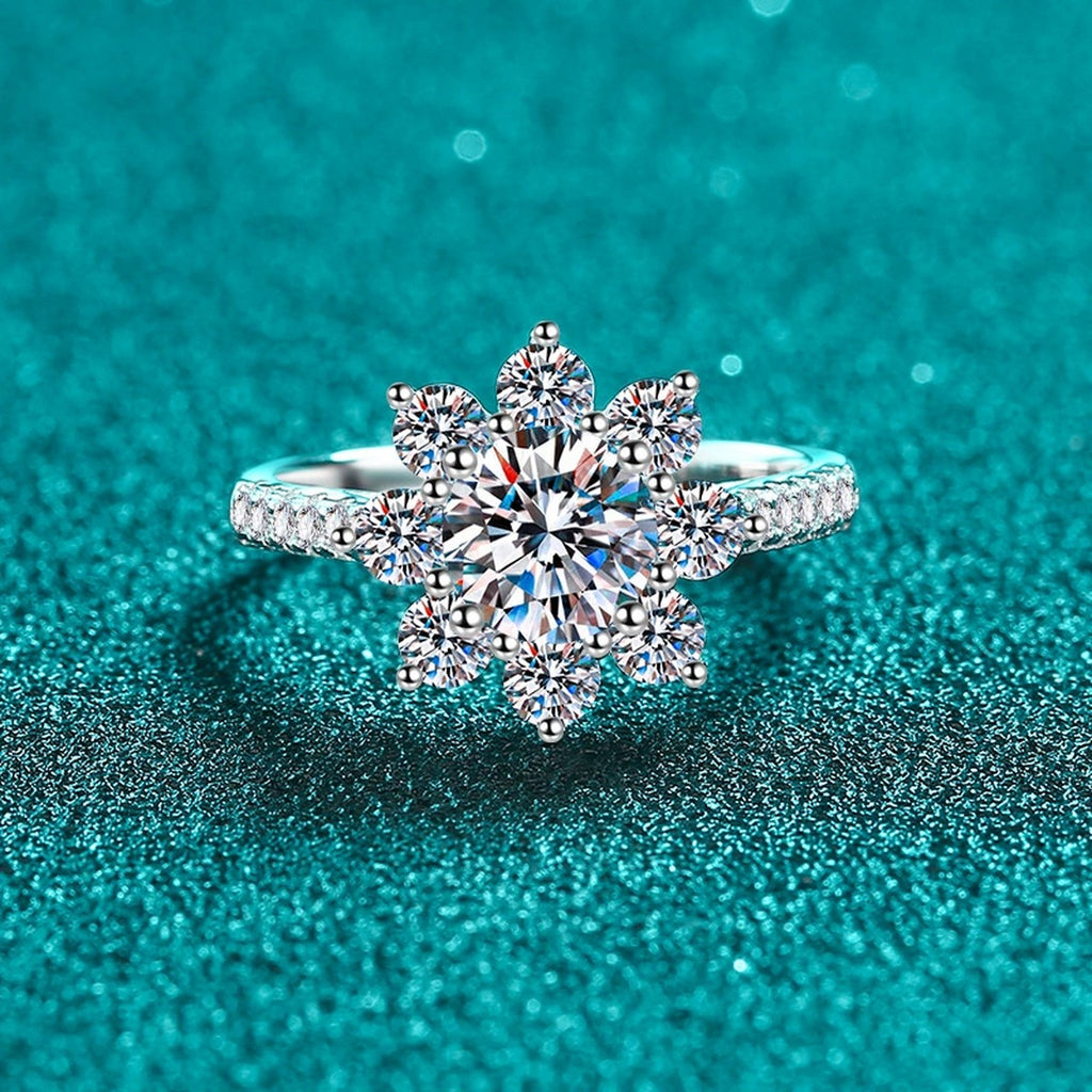 Round Moissanite Side Stone Engagement Ring with CZ in Rhodium-Plated S925 Sterling Silver blue display product photo showing the moissanite setting, stone cut, and band profile