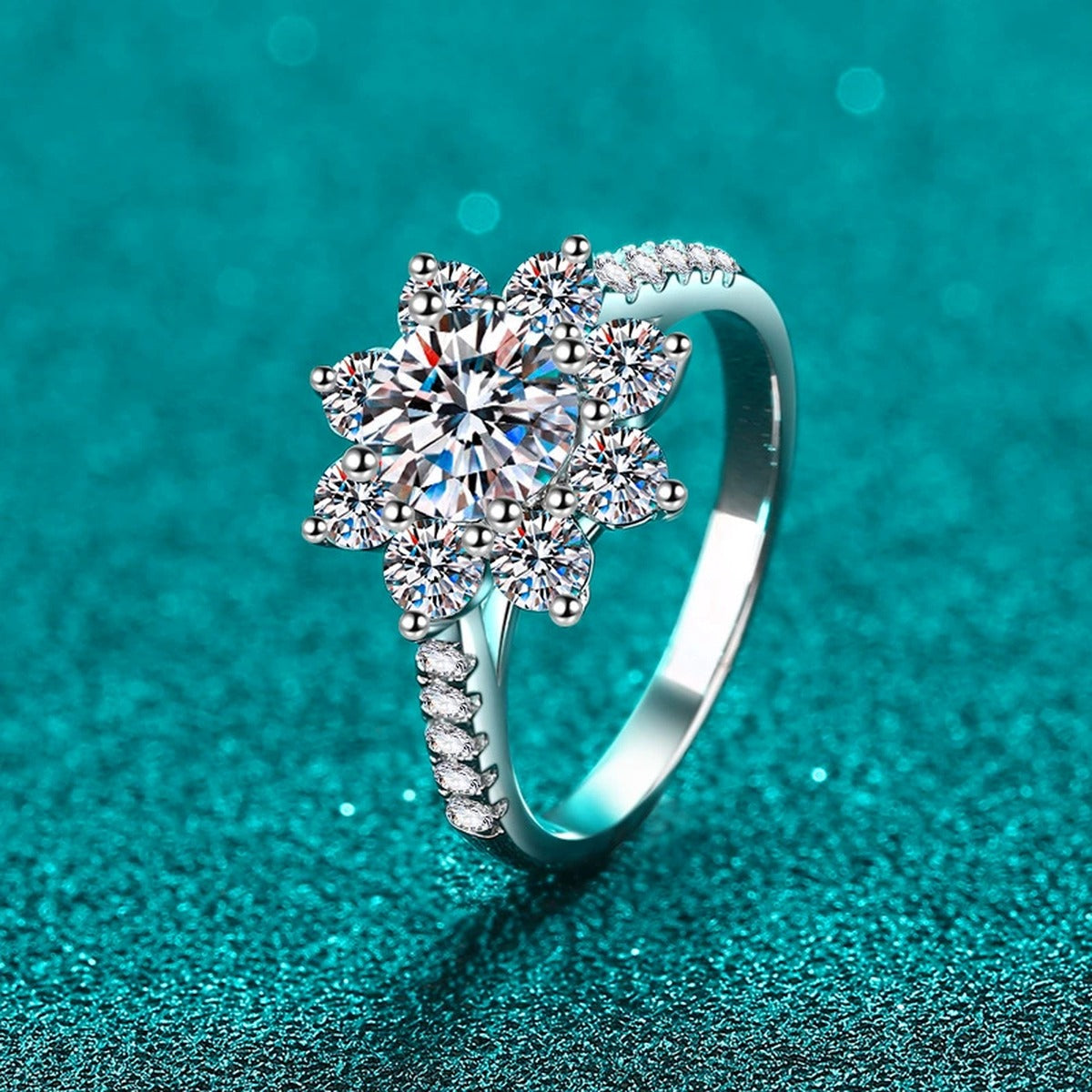 Round Moissanite Side Stone Engagement Ring with CZ in Rhodium-Plated S925 Sterling Silver blue display product photo showing the moissanite setting, stone cut, and band profile