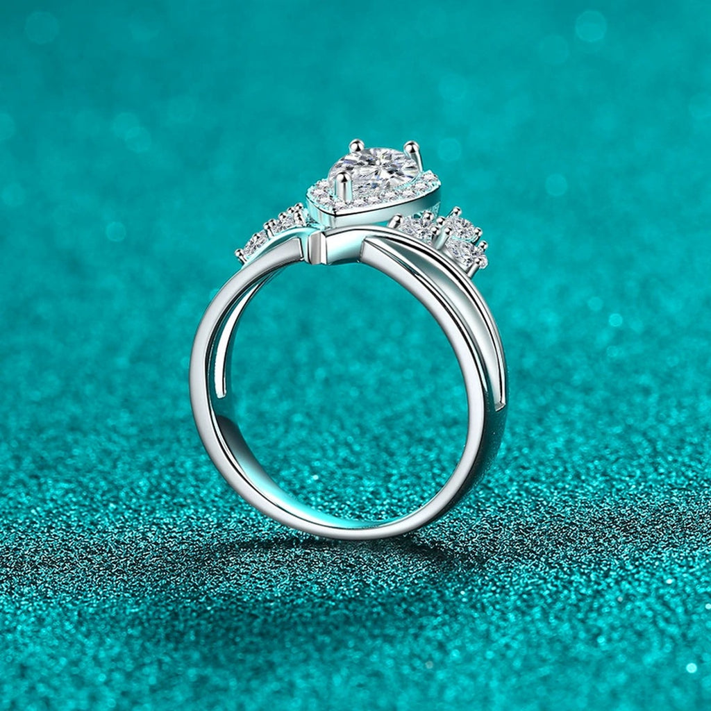 Pear Cut Moissanite Side Stone Engagement Ring with CZ product view showing moissanite setting and metal finish