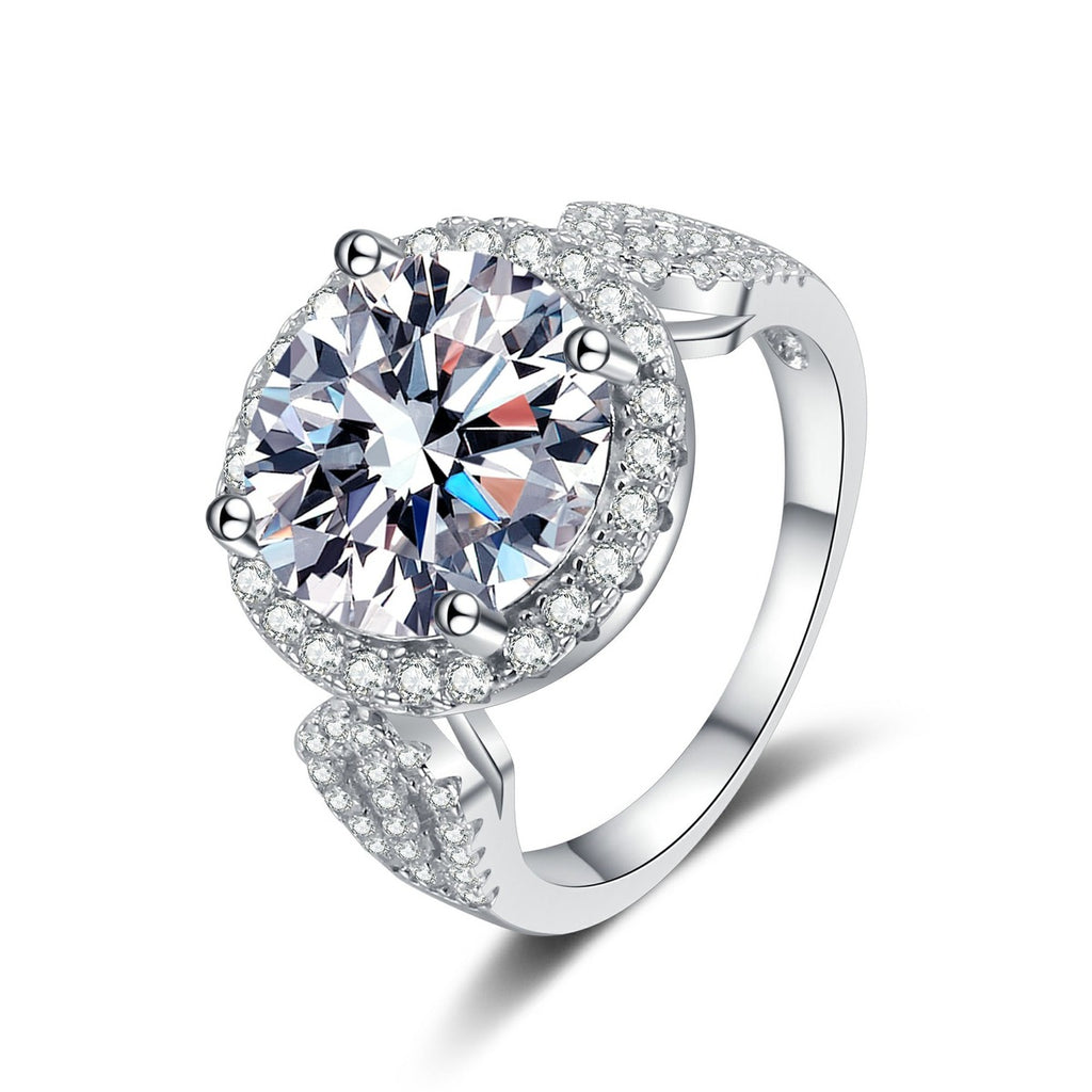 Round Halo Moissanite Ring with CZ in rhodium-plated S925 sterling silver on clean white background