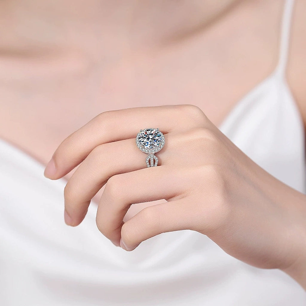 Round Halo Moissanite Ring with CZ worn on hand to show scale, band width, and ring profile