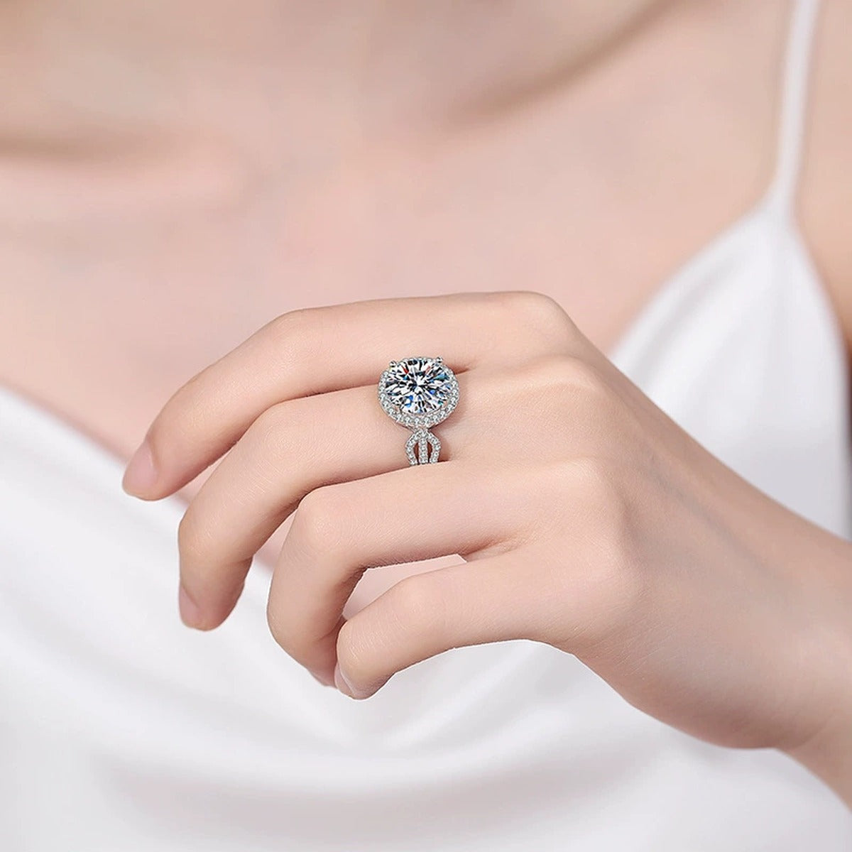 Round Halo Moissanite Ring with CZ worn on hand to show scale, band width, and ring profile