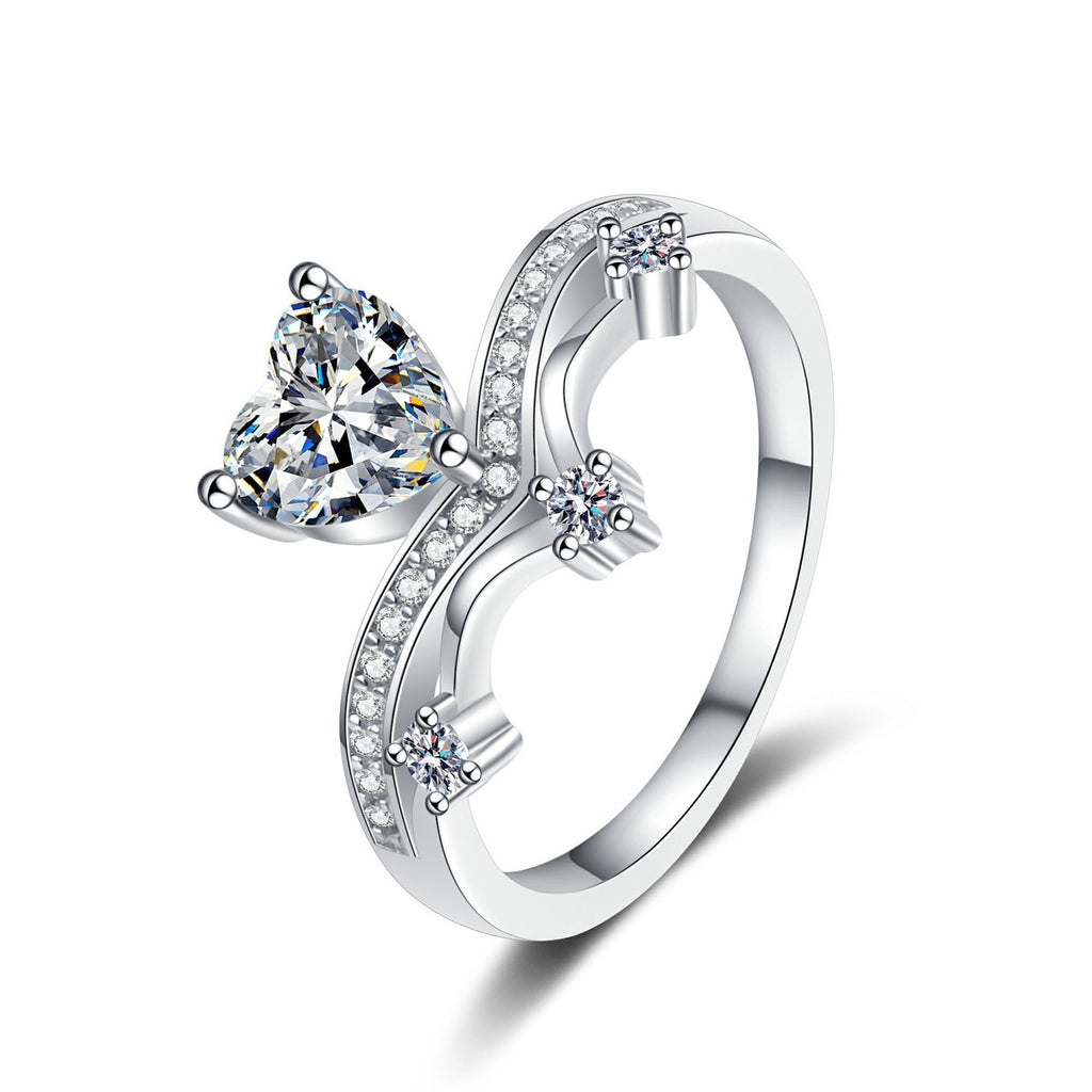 Heart Cut Moissanite Side Stone Engagement Ring with CZ in rhodium-plated S925 sterling silver on clean white background