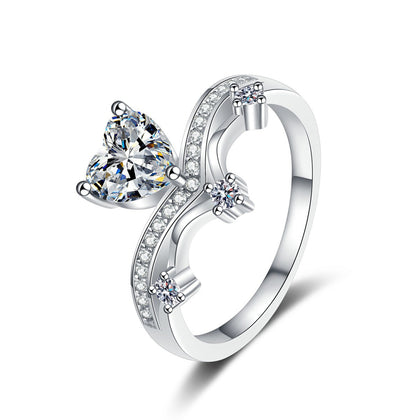 Heart Cut Moissanite Side Stone Engagement Ring with CZ in rhodium-plated S925 sterling silver on clean white background