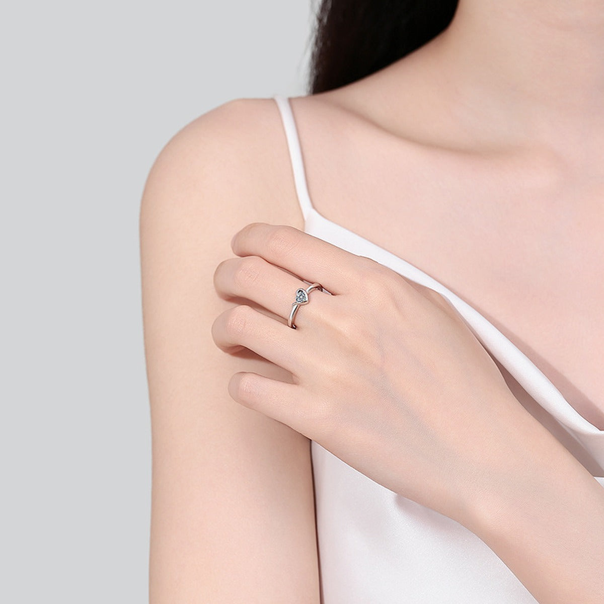 Heart Cut Moissanite Promise Ring worn on hand to show scale, band width, and ring profile