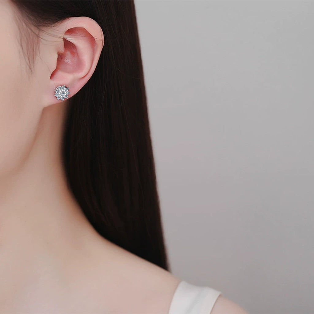 Snowflake Moissanite Stud Earrings in Rhodium-Plated S925 sterling silver worn on ear by model showing scale, placement, and stud earrings styling