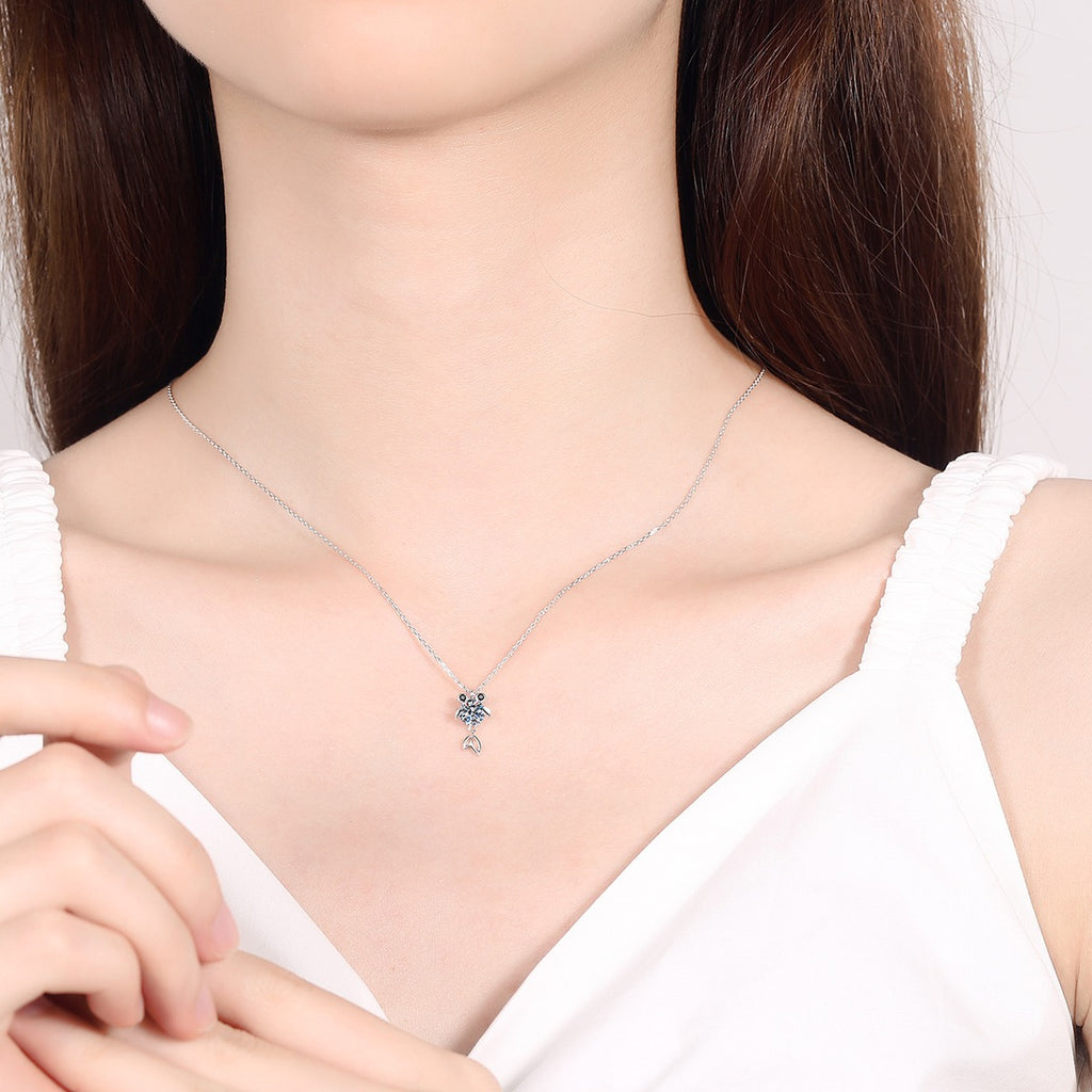 Fish Moissanite Pendant Necklace with CZ in Rhodium-Plated S925 sterling silver worn on neckline by model showing scale and adjustable chain styling