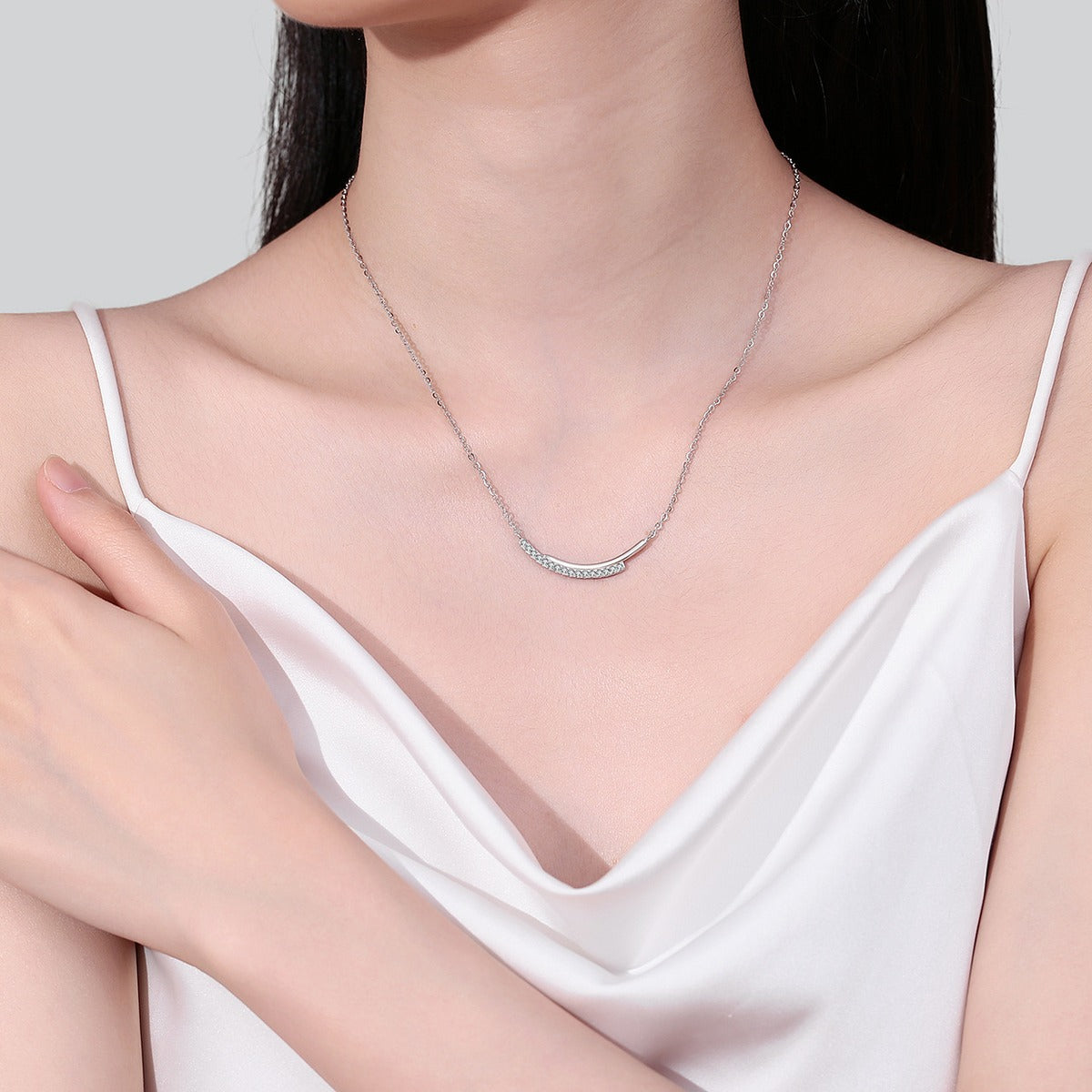 Smile Bar Moissanite Necklace in Rhodium-Plated S925 sterling silver neckline model view showing pendant scale and adjustable chain