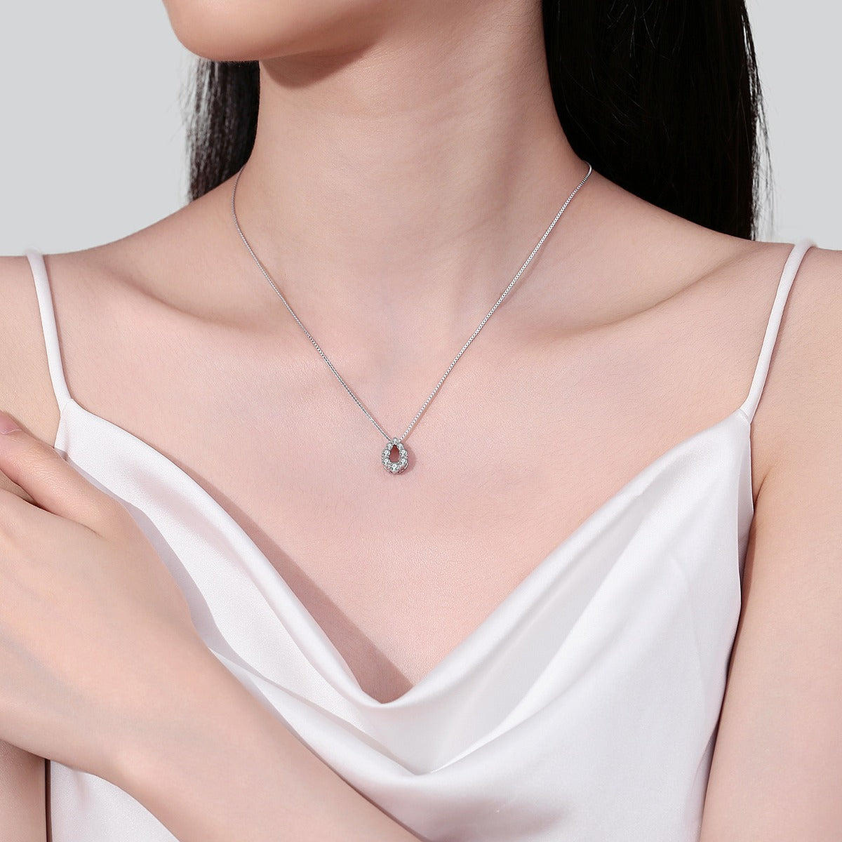 Teardrop Moissanite Pendant Necklace in Rhodium-Plated S925 sterling silver neckline model view showing pendant scale and chain length