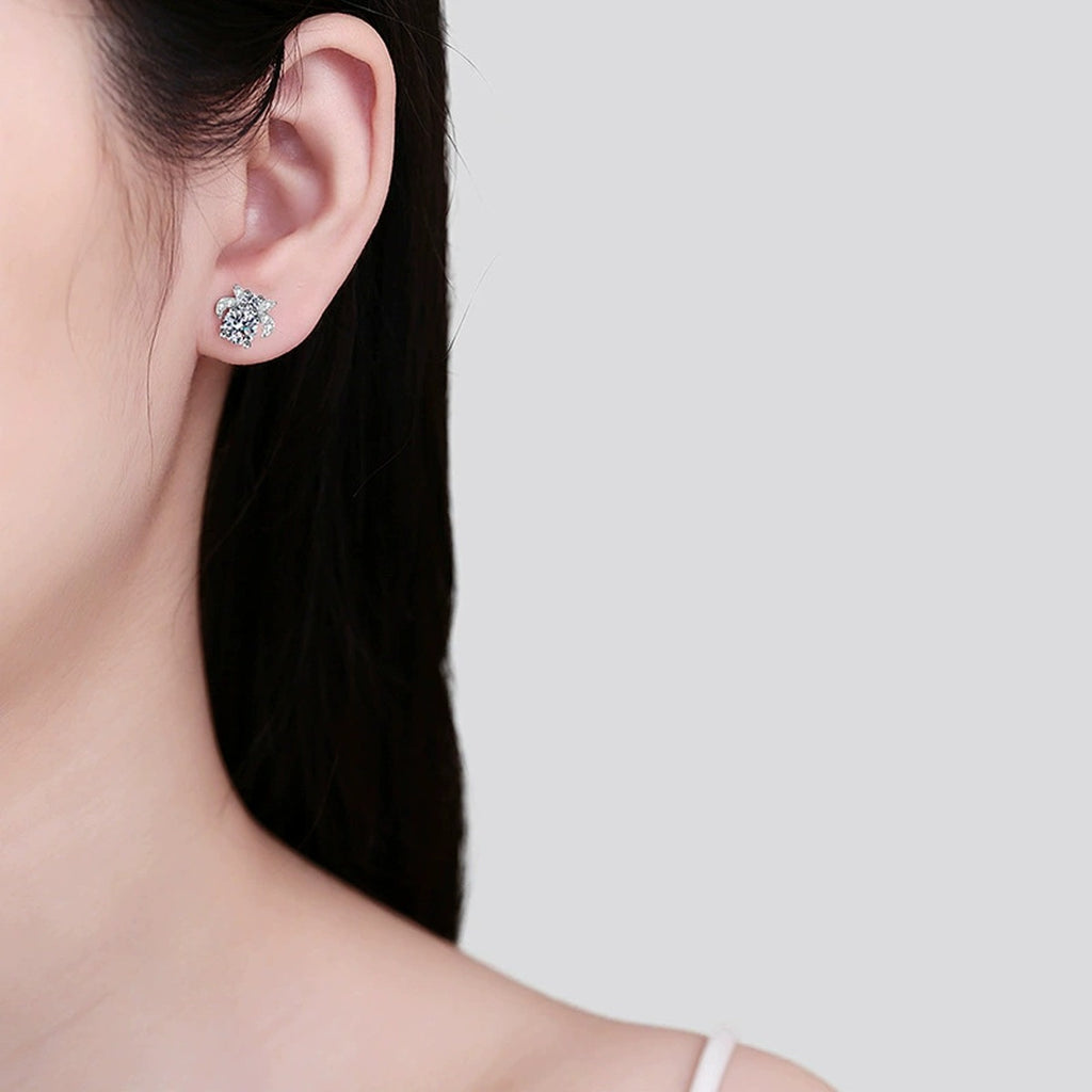 Floral Moissanite Stud Earrings with CZ in Rhodium-Plated S925 sterling silver worn on ear by model showing scale, placement, and stud earrings styling