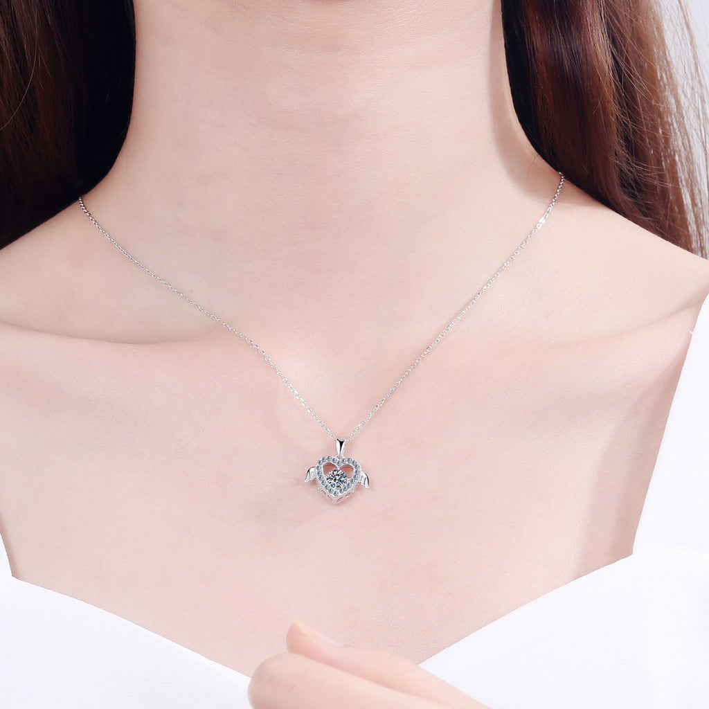 Heart Wing Moissanite Pendant Necklace with CZ in Rhodium-Plated S925 sterling silver worn on neckline by model showing scale and adjustable chain styling