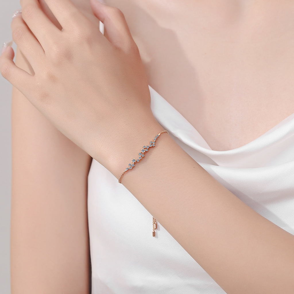 Star Moissanite Chain Bracelet in Champion Gold-Plated S925 sterling silver worn on wrist model view showing scale and adjustable fit