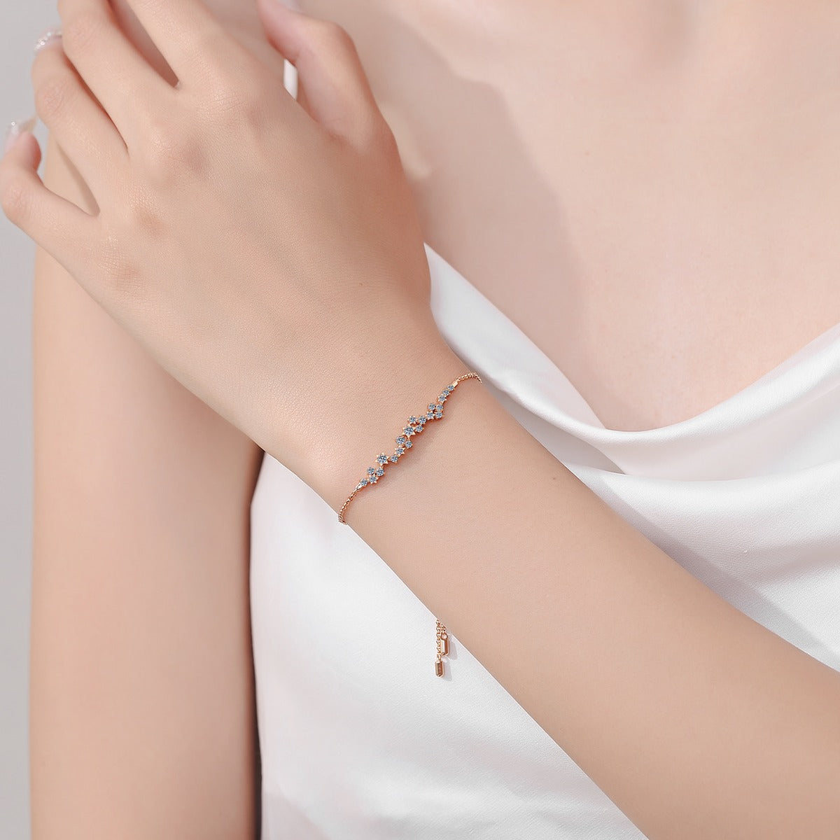 Star Moissanite Chain Bracelet in Champion Gold-Plated S925 sterling silver worn on wrist model view showing scale and adjustable fit