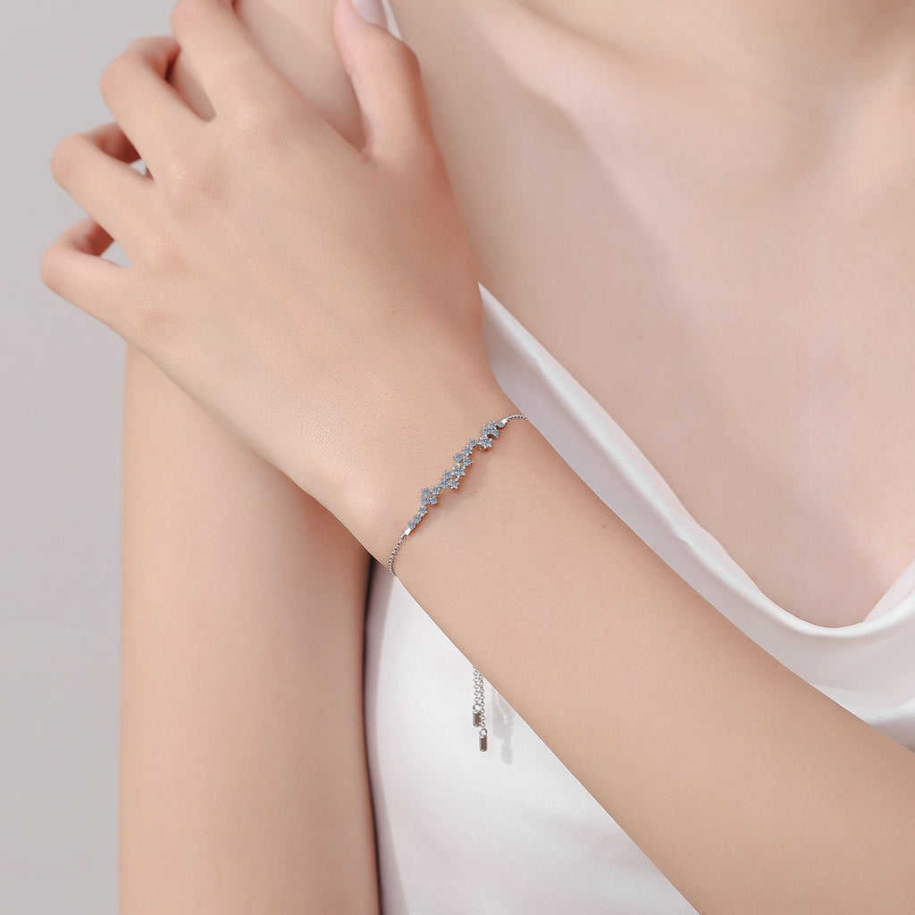 Star Moissanite Chain Bracelet in Rhodium-Plated S925 sterling silver worn on wrist model view showing scale and adjustable fit
