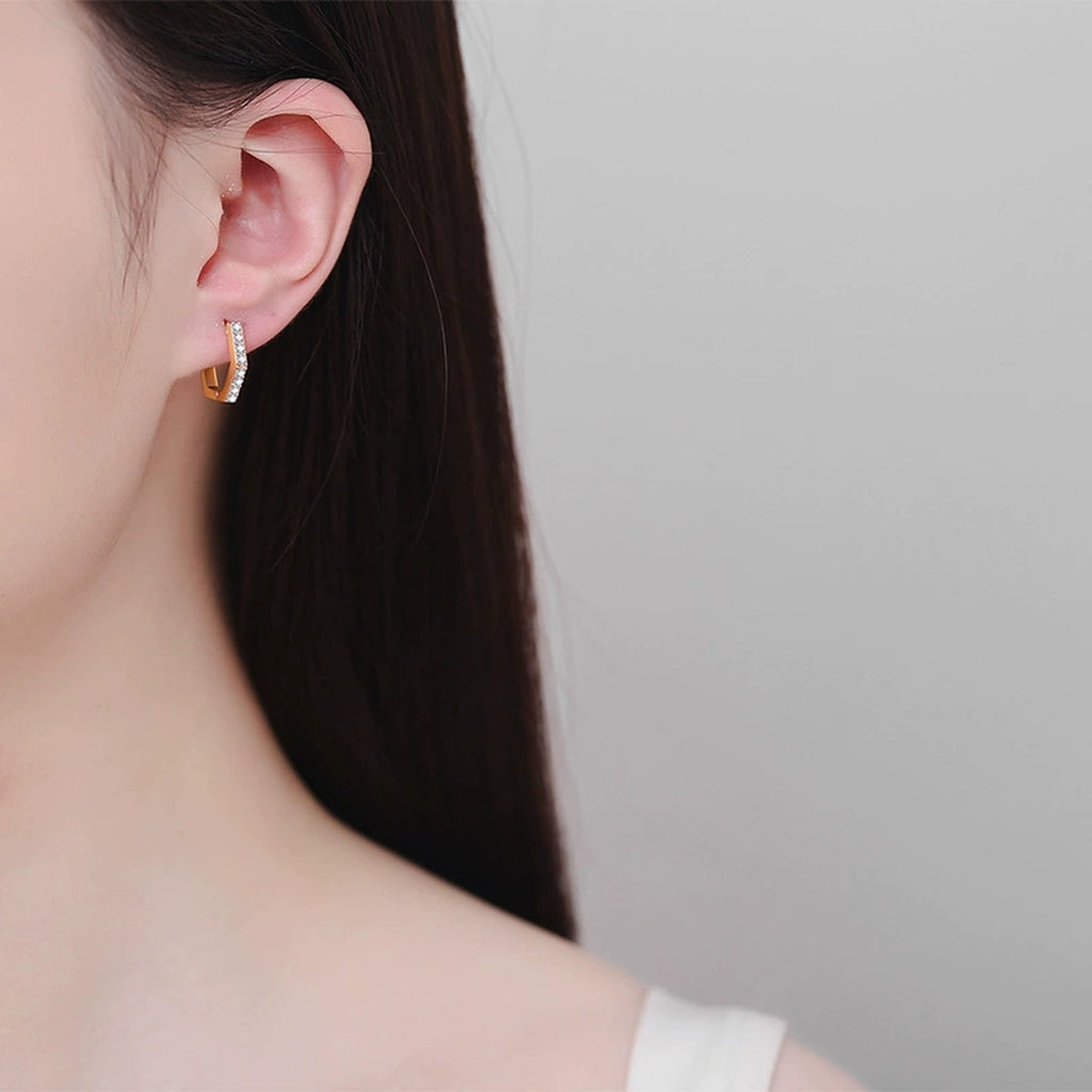 Hexagon Moissanite Hoop Earrings in Champion Gold-Plated S925 sterling silver worn on ear by model showing scale, placement, and hoop earrings styling