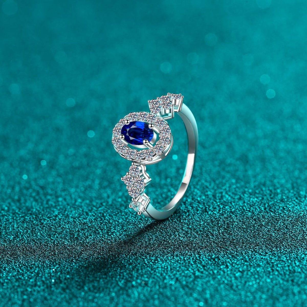 Blue and White Oval Moissanite Ring with CZ in Rhodium-Plated S925 Sterling Silver blue display product photo showing the moissanite setting, stone cut, and band profile