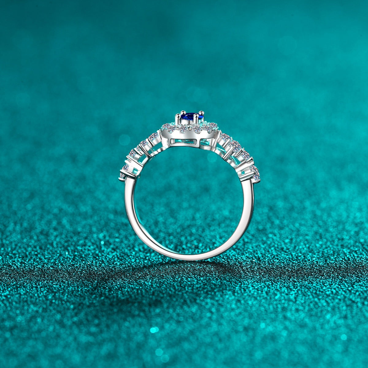 Blue and White Oval Moissanite Ring with CZ in Rhodium-Plated S925 Sterling Silver blue display product photo showing the moissanite setting, stone cut, and band profile