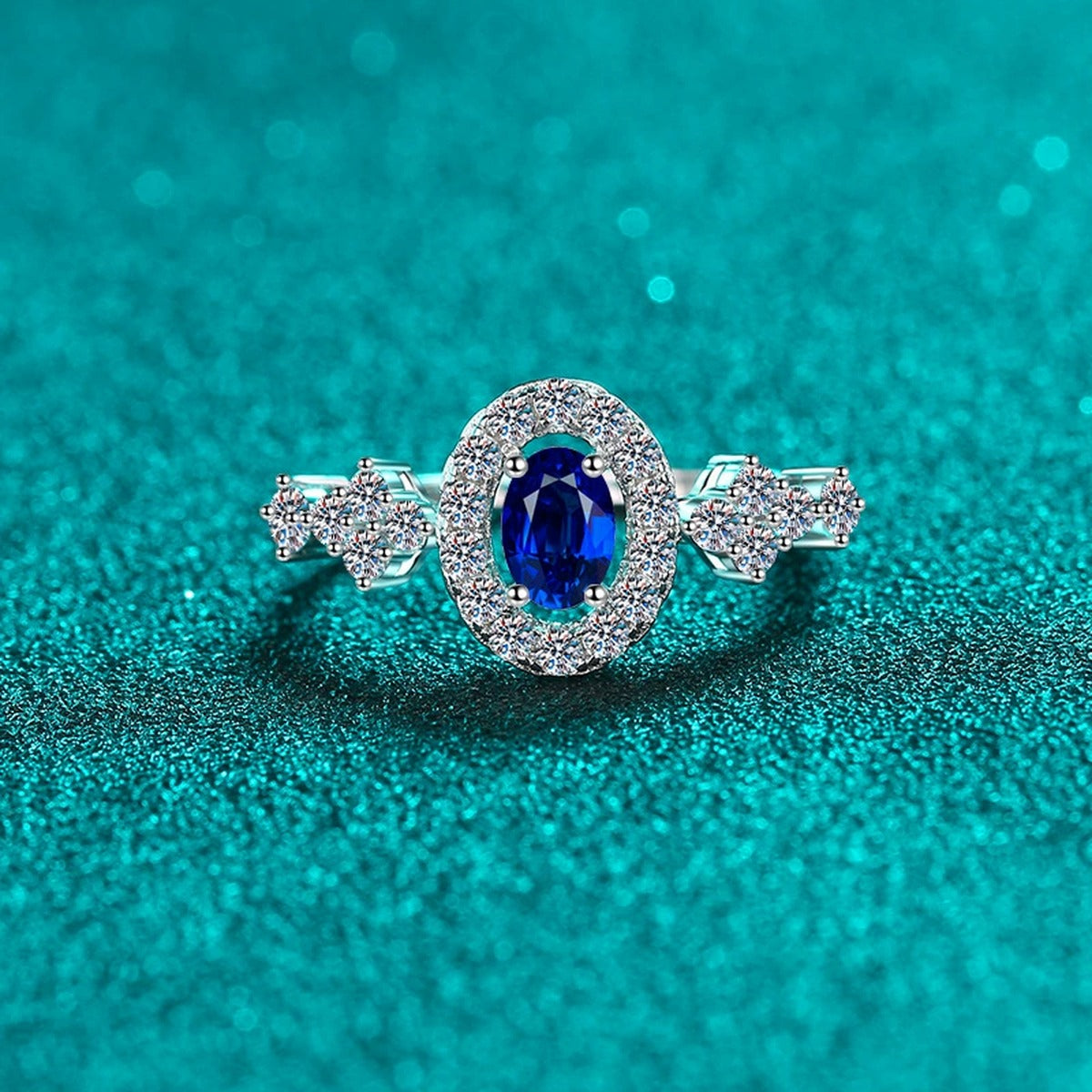 Blue and White Oval Moissanite Ring with CZ in Rhodium-Plated S925 Sterling Silver blue display product photo showing the moissanite setting, stone cut, and band profile