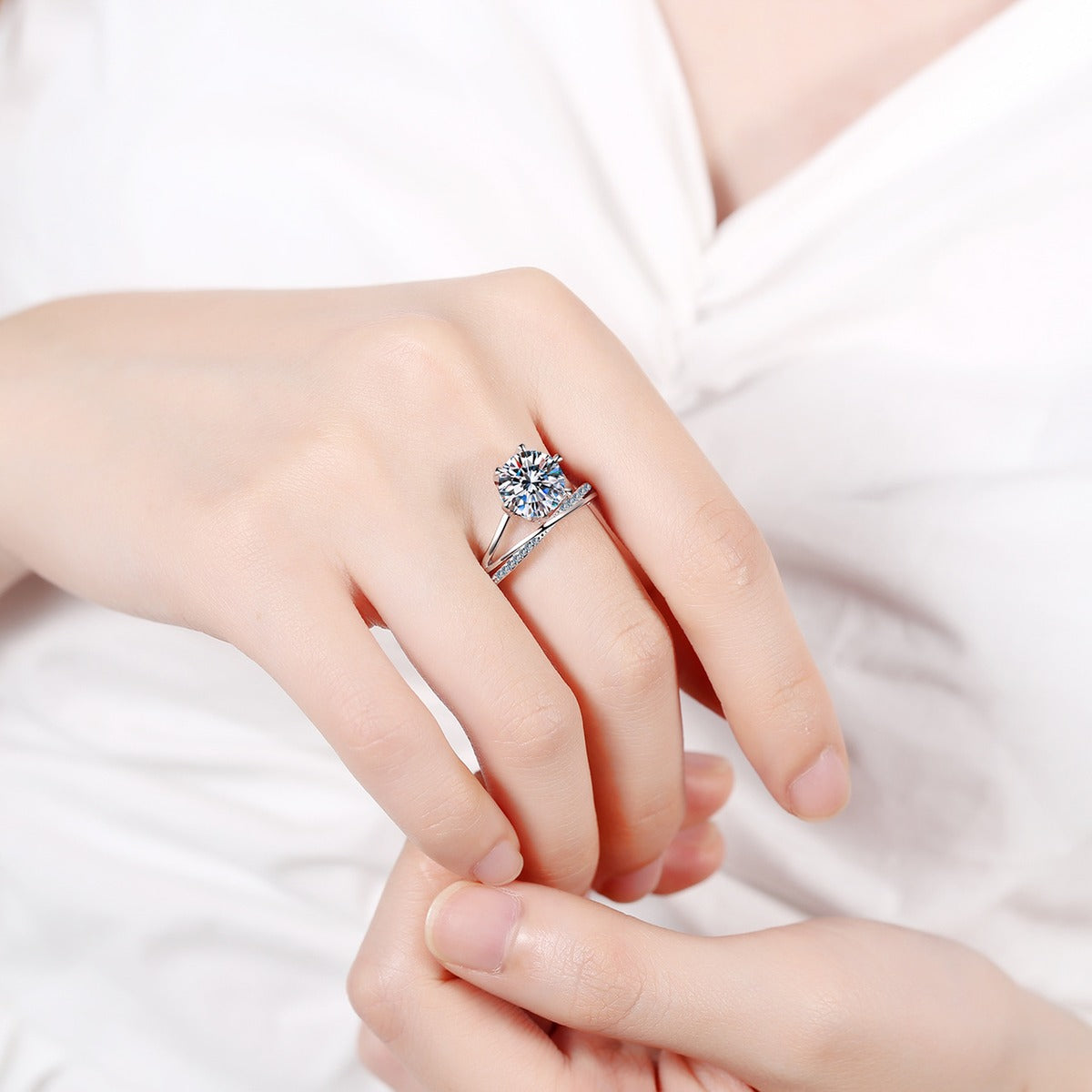 Round Moissanite Split Shank Engagement Ring with CZ worn on hand to show scale, band width, and ring profile