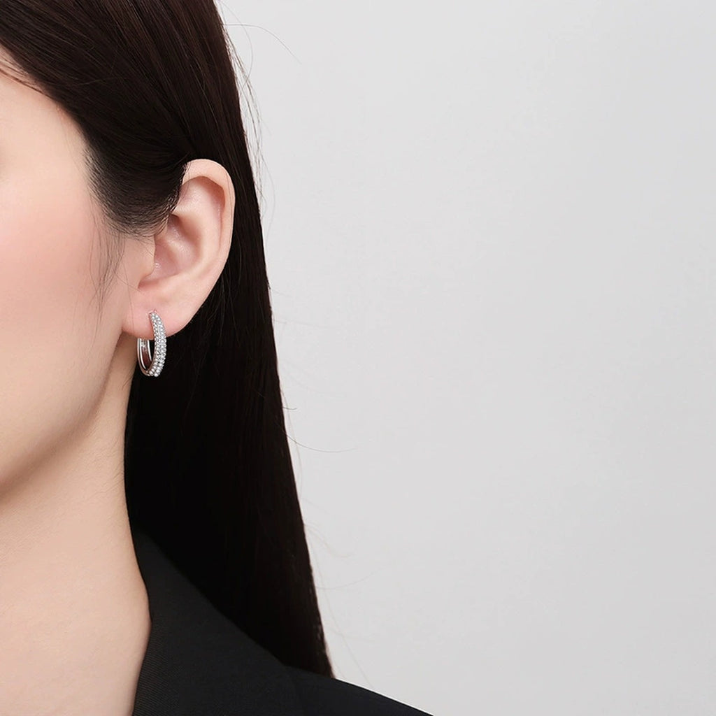 Slim Pave Moissanite Hoop Earrings in Rhodium-Plated S925 sterling silver worn on ear by model showing scale, placement, and hoop earrings styling