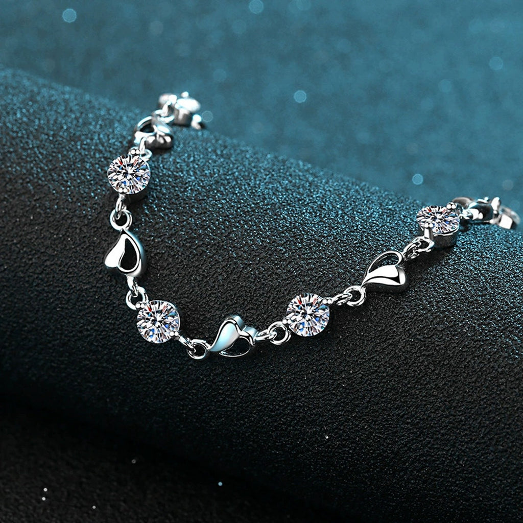 Heart Charm Moissanite Adjustable Bracelet in Rhodium-Plated S925 sterling silver angled product display showing bracelet silhouette