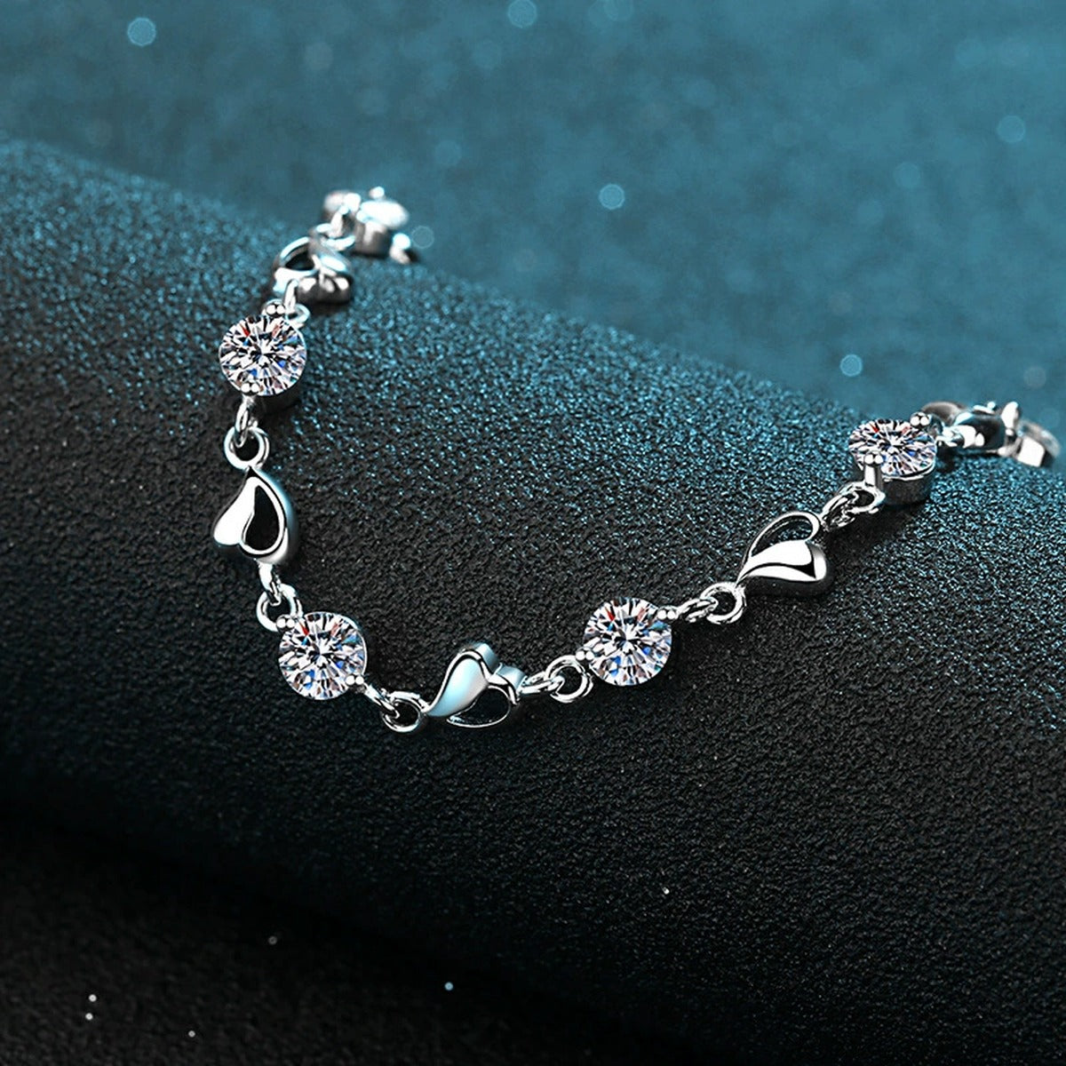 Heart Charm Moissanite Adjustable Bracelet in Rhodium-Plated S925 sterling silver angled product display showing bracelet silhouette
